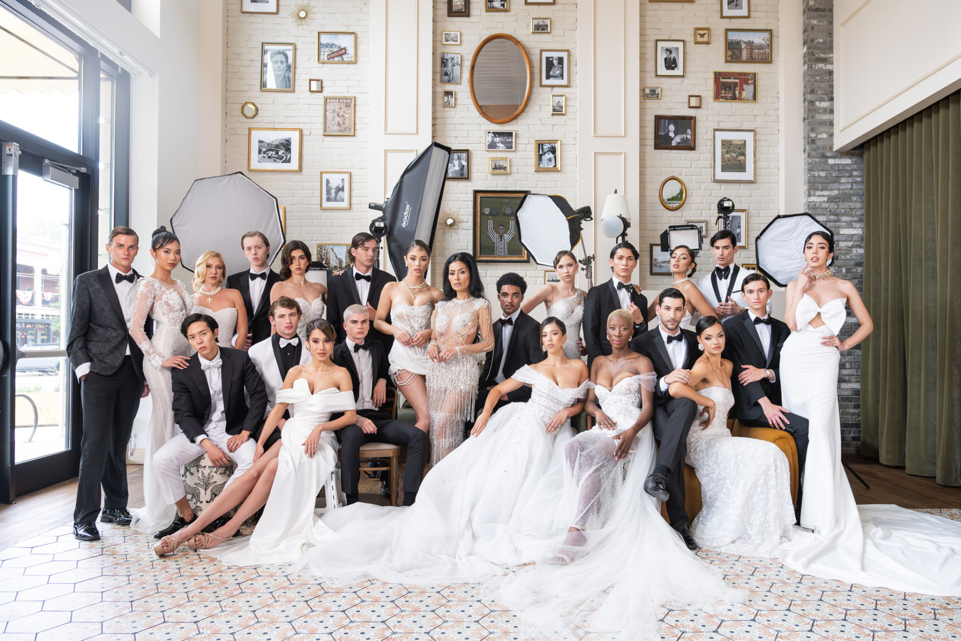 Large ensemble cast portrait in formalwear and bridal couture