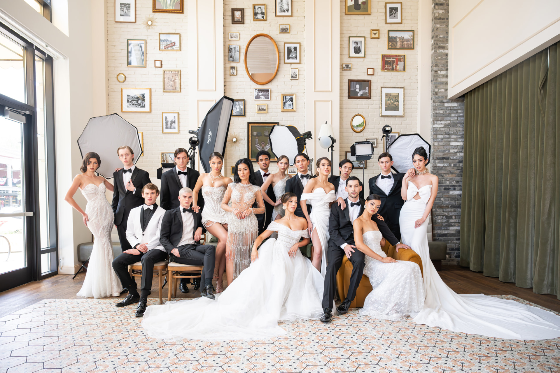 Models and tuxedoed men posed together in the salon